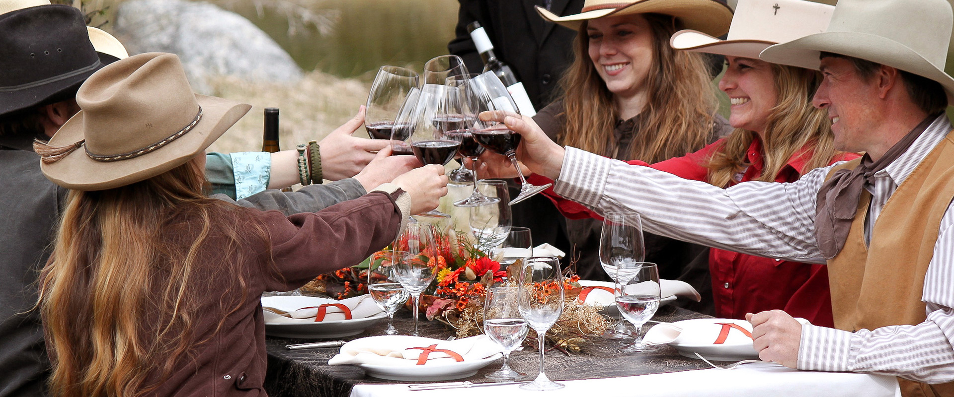 Guests toasting at a Thanksgiving feast