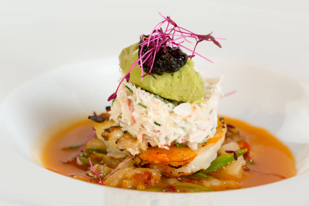 Red Hawaiian Crab with Grilled Prawn, Avocado Mousse, Cabbage, Kimchi Butter, Divine Caviar and Amaranth Greens Culinary Plating Class cuisine