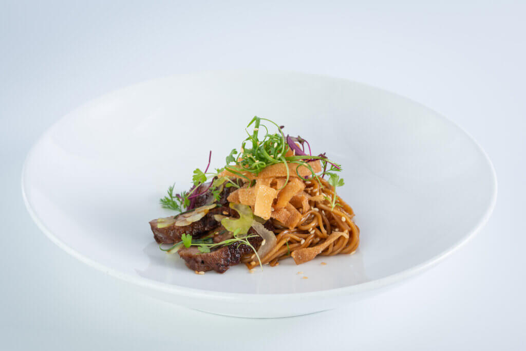 Muscovy Duck Breast
Somen noodles, shaved celery, crispy wonton, curled scallions, ginger shoyu, toasted sesame Culinary Plating Class, cuisine