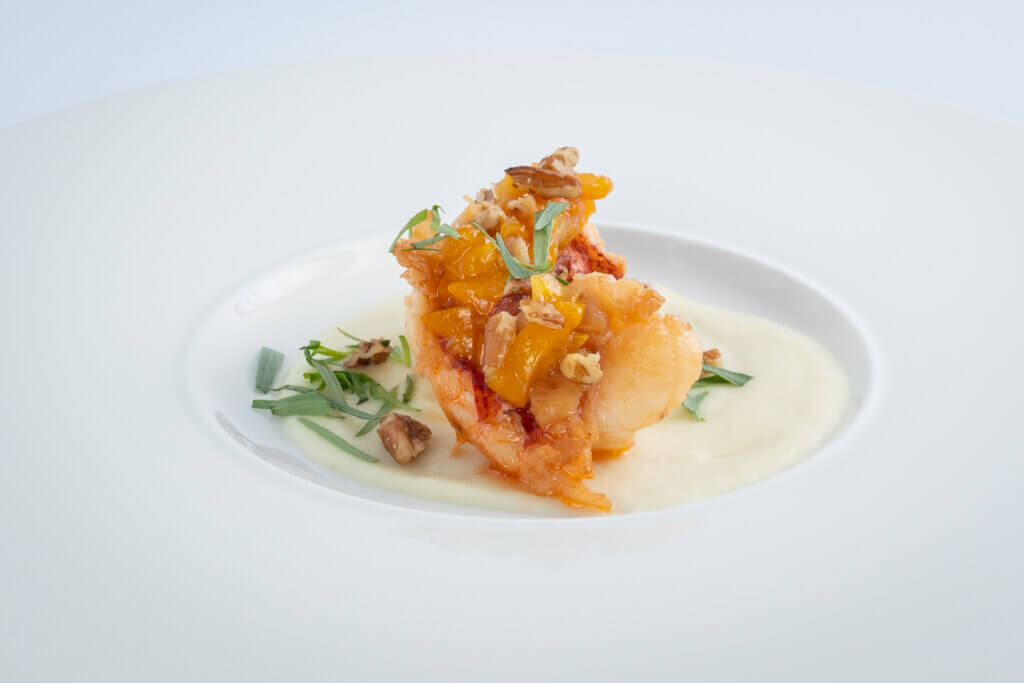 Seared Lobster Tail
Parsnip puree, toasted pecans, kumquat gastrique, fresh tarragon Culinary Plating  cuisine