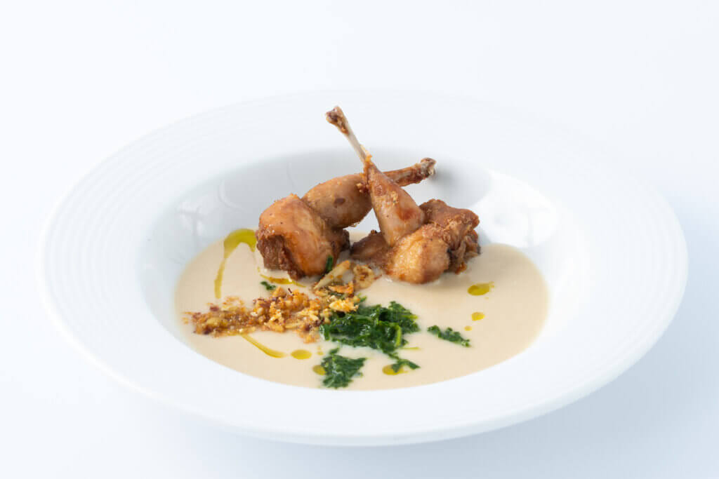 Local Turnip Bisque with quail lollipops, fresh tarragon, and toasted almonds. Cuisine