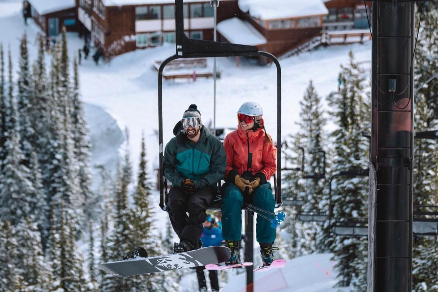 Lost Trail Ski Area Lift Chair Couple with Triple Creek Ranch Ski and Sip Event